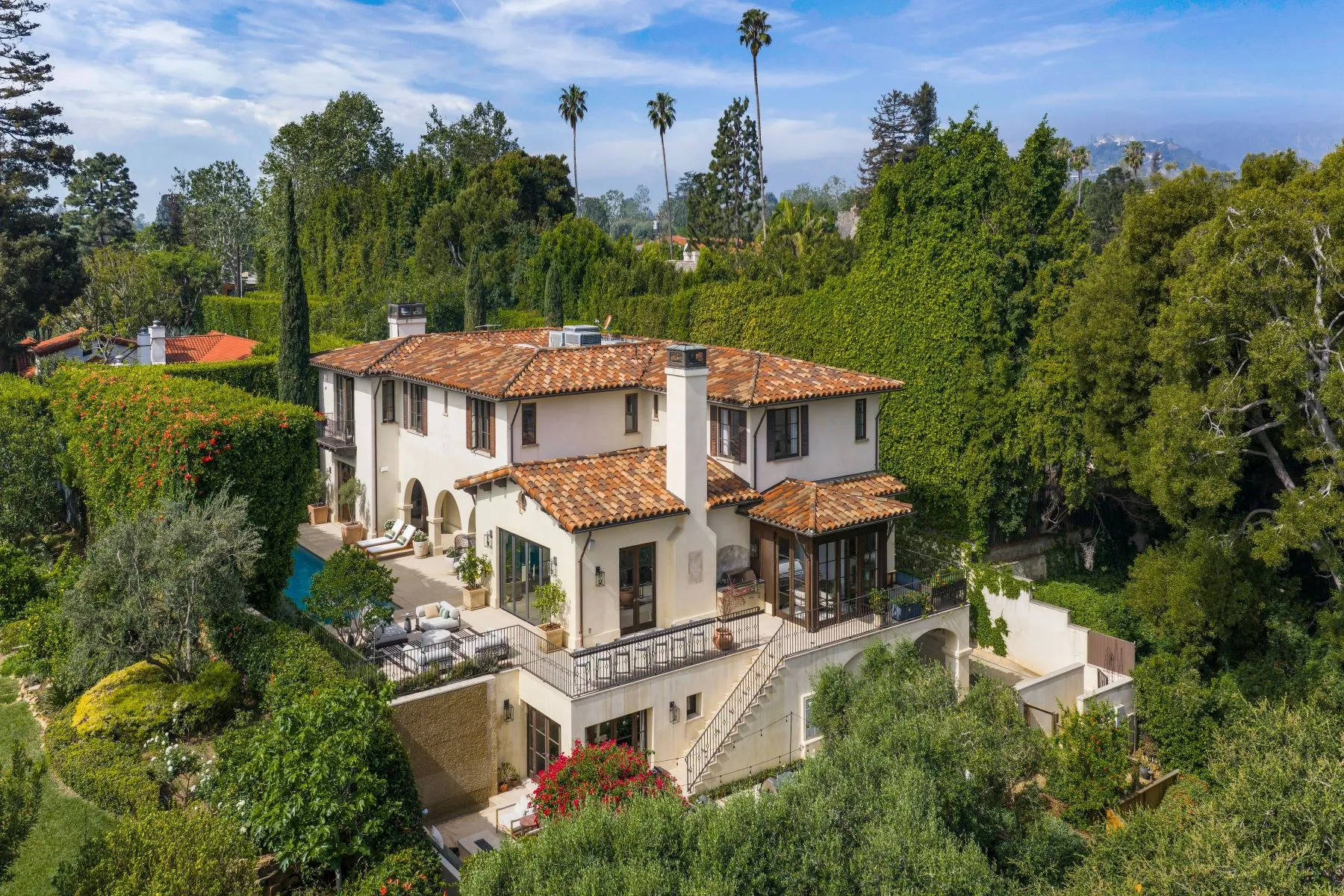 Spanish colonial luxury home aerial view with terracotta roof